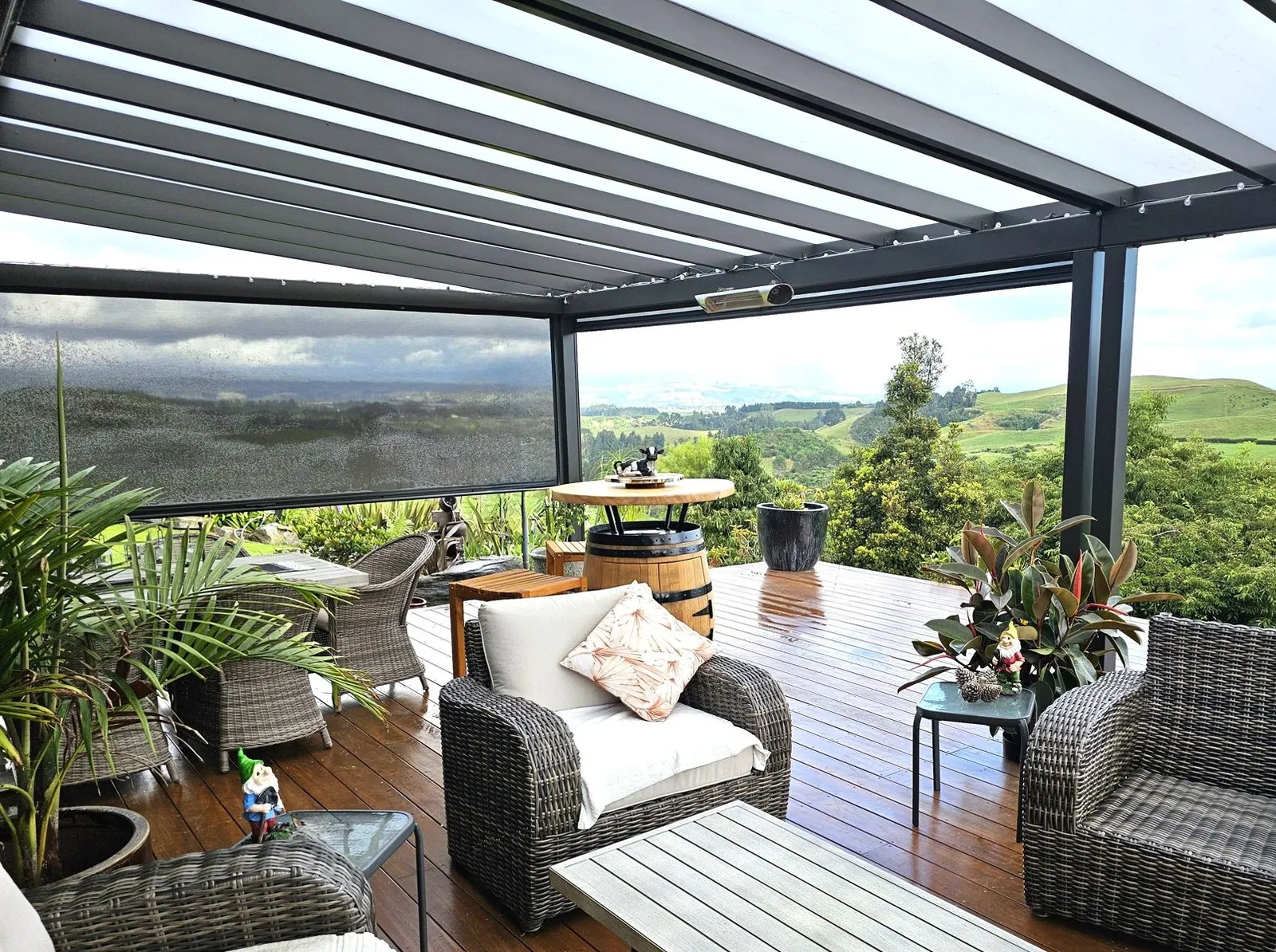 Furnished lounge under a Galaxy pergola with rural views