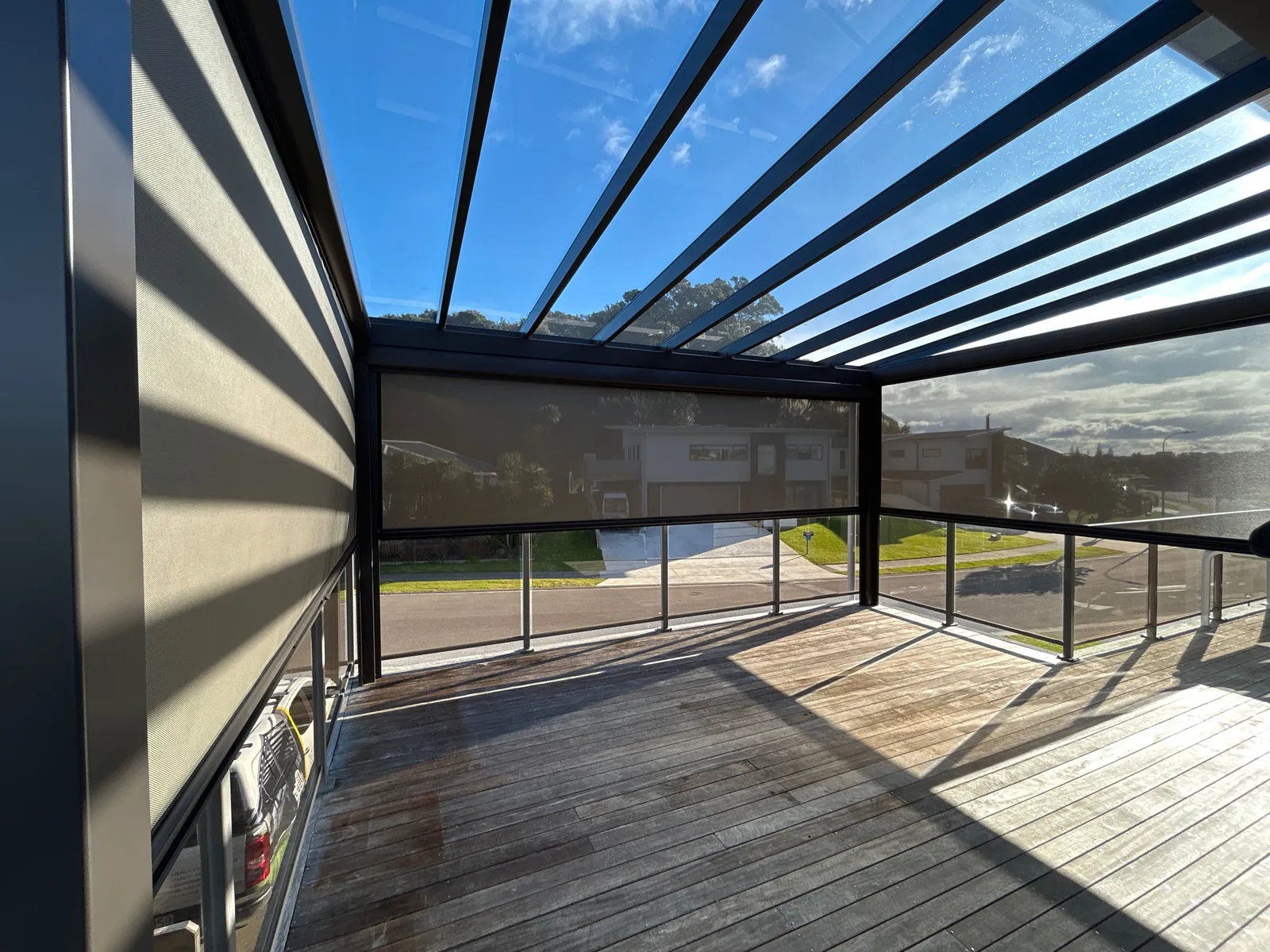 Outdoor entertaining area with a dark-framed pergola